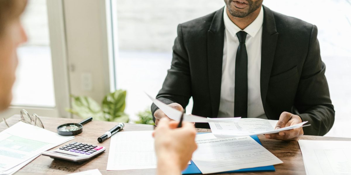 An individual discusses financing options and payment plans with a financial advisor.