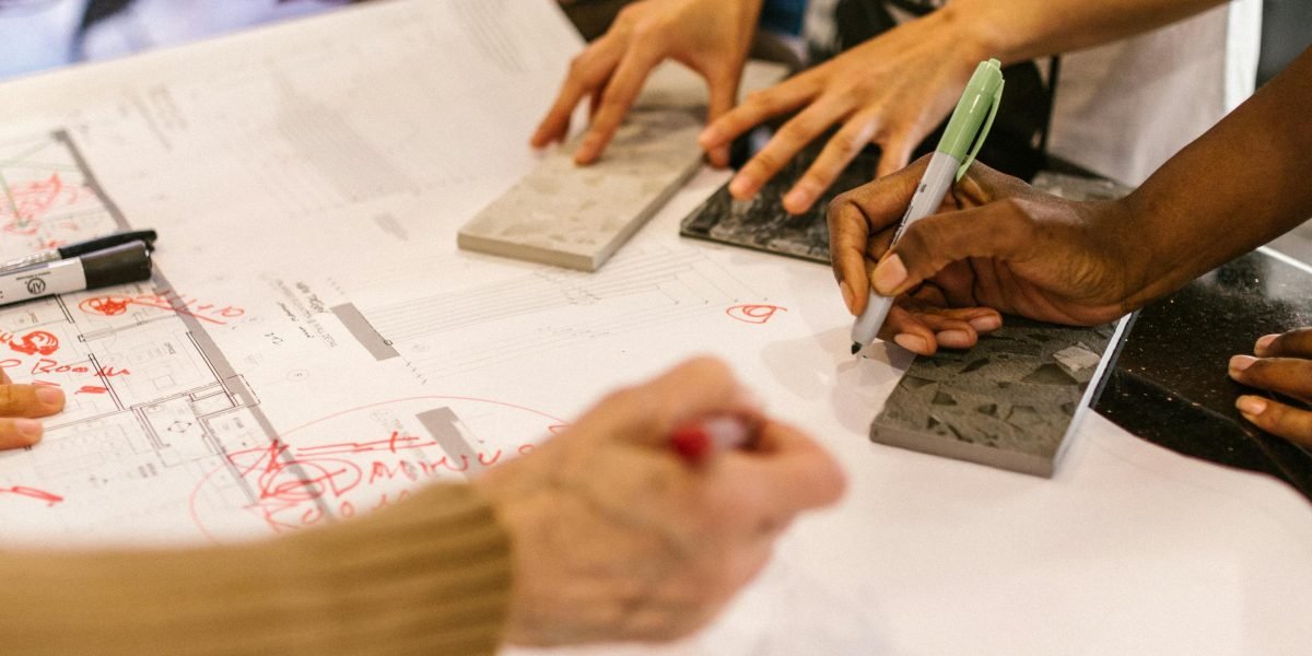 Individuals discussing property options, symbolizing the process of comparing and selecting the best fit for their lifestyle or investment goals.