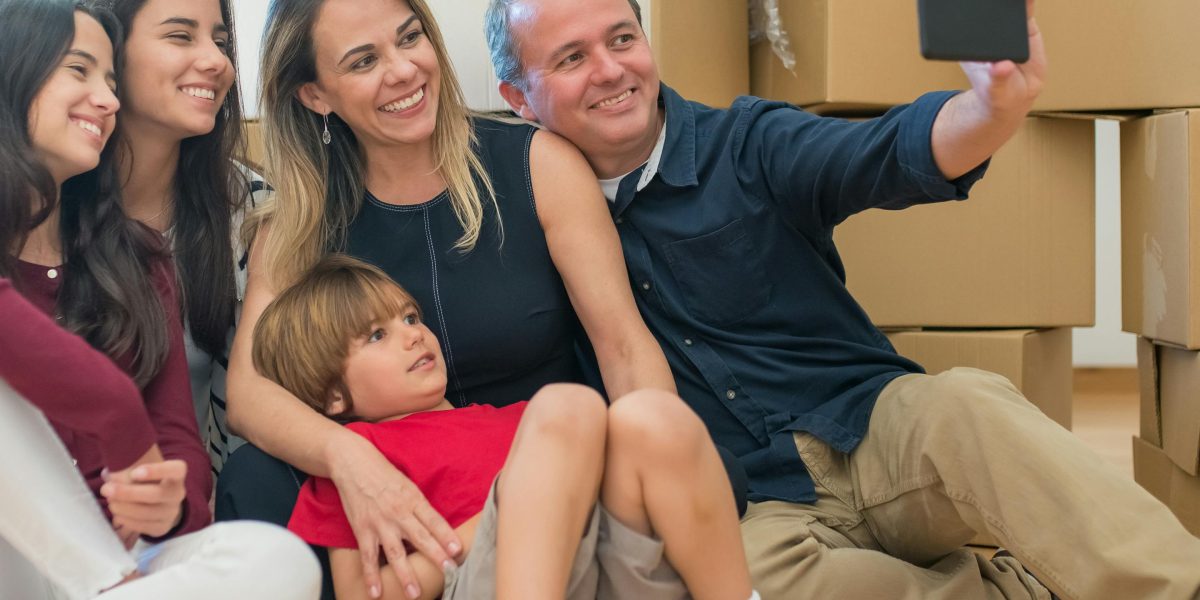 An expat family happily settling into a new, luxurious serviced apartment, adapting to their new environment.