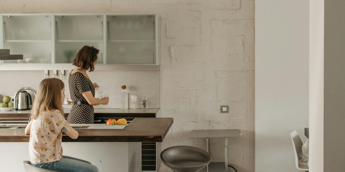 A family enjoying the spaciousness and convenience of a luxury serviced apartment, providing comfort and hotel amenities.