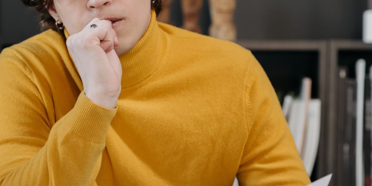 A person thoughtfully considering options, symbolizing the process of making a significant choice.