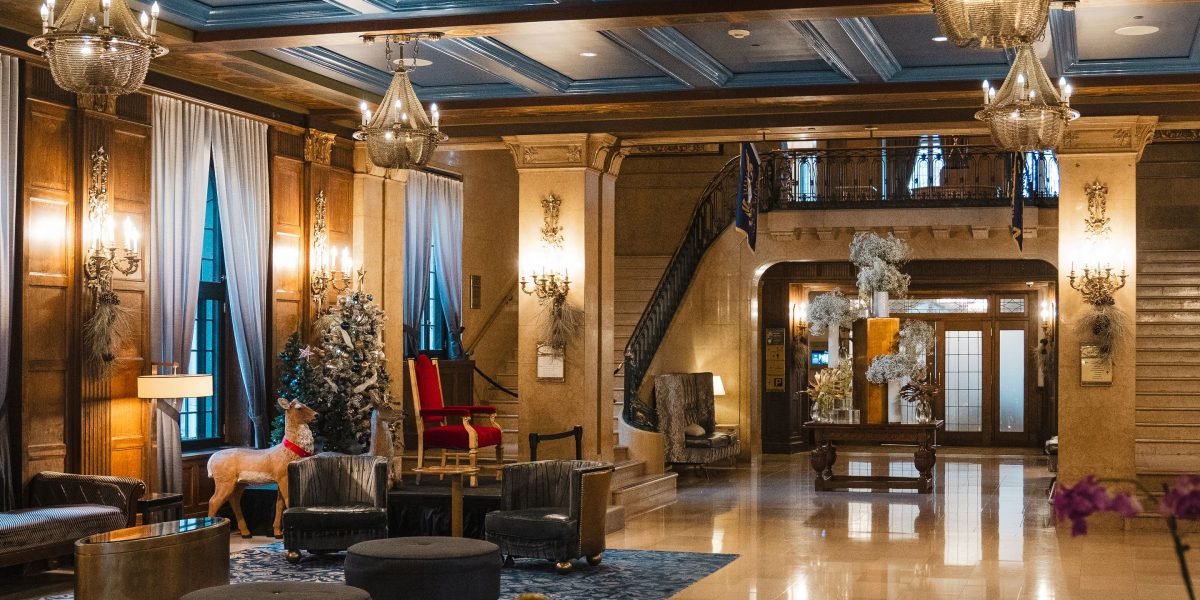 A person relaxing and taking in the distinctive ambiance of a boutique hotel lobby.