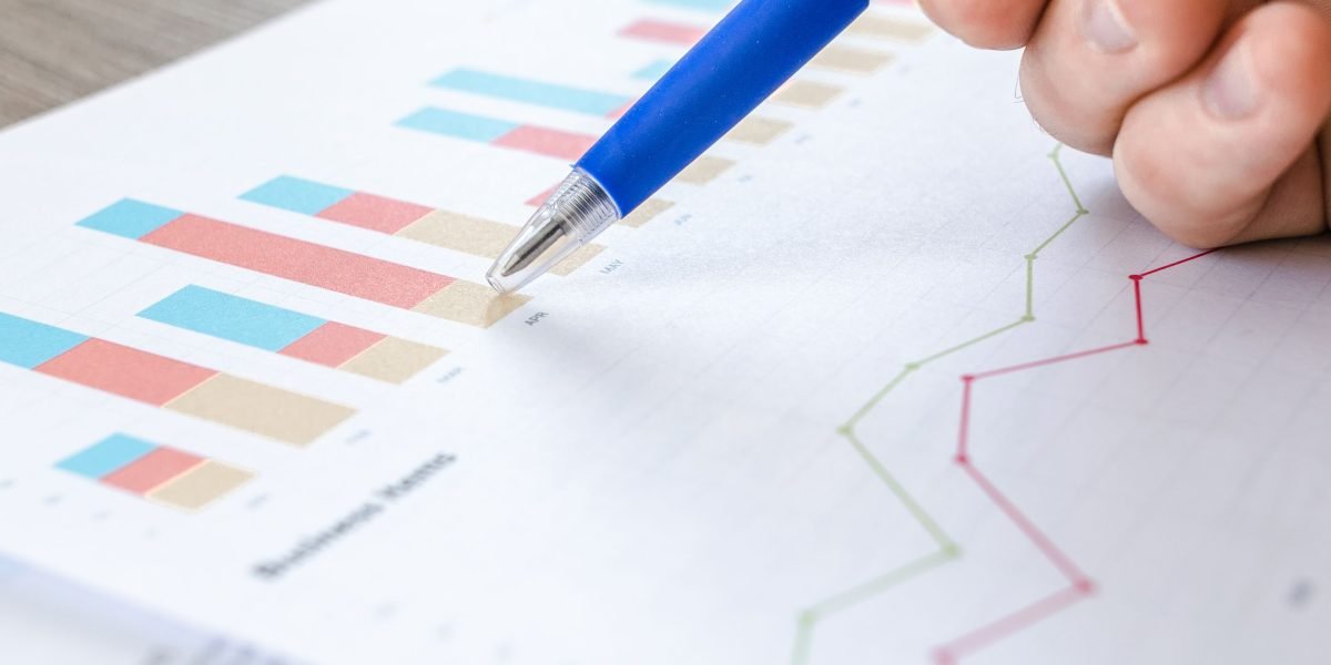 An investor carefully reviewing financial reports, symbolizing the analysis of rental yields and occupancy trends in Dubai property.