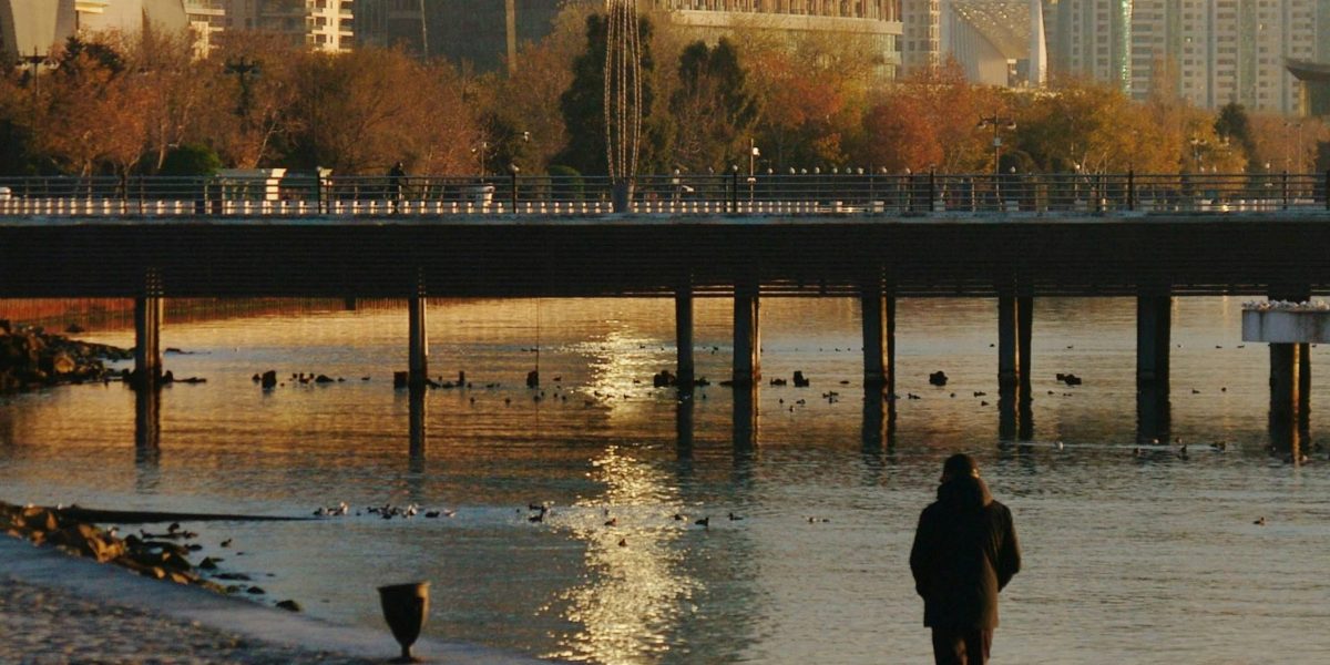 A person enjoying the vibrant urban lifestyle and scenic lake views common in JLT.