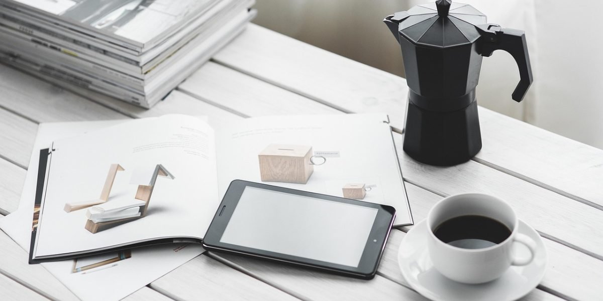 A person reviewing travel plans on a digital device, symbolizing frequent and thoughtful booking.