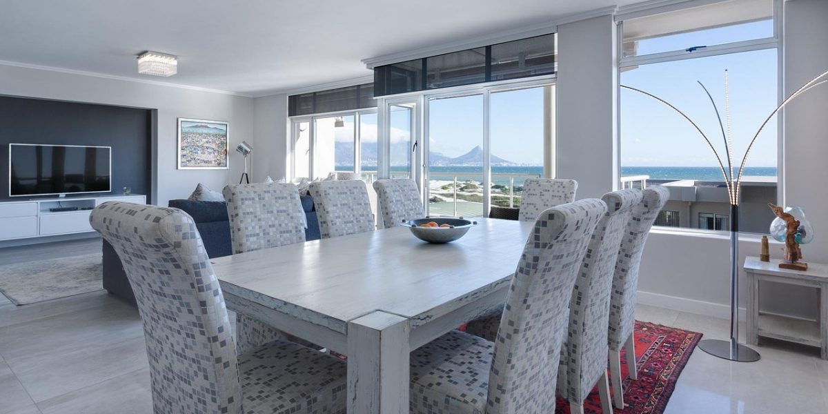 A family happily enjoying a spacious living area within a hotel apartment, emphasizing comfort and shared space.