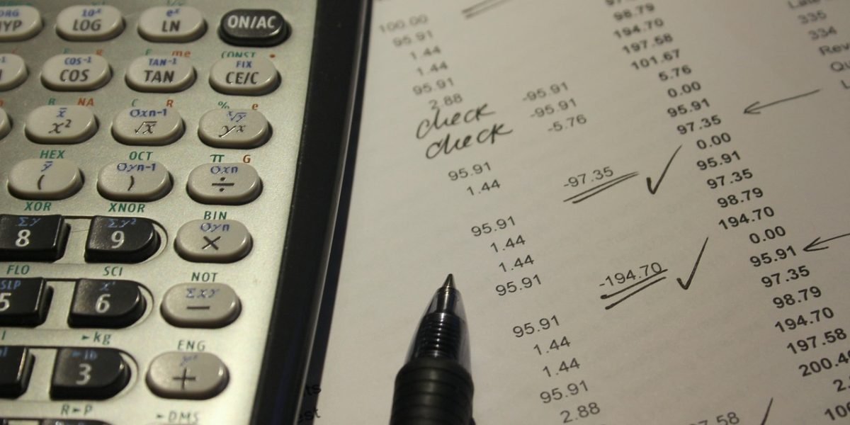 An investor focused on analyzing market data, reflecting the diligence required before making property investment decisions.