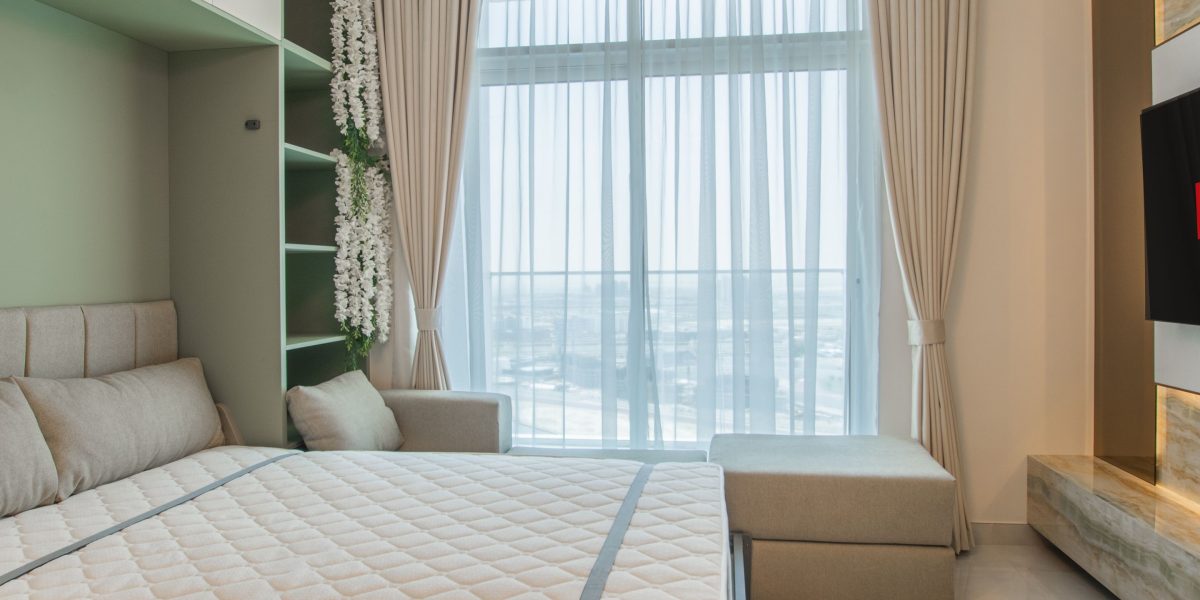 A family enjoying their spacious and comfortable hotel apartment, showcasing the benefits for travelers.